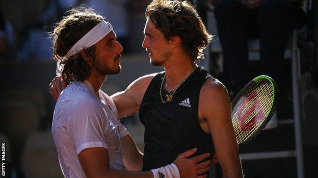 Stefanos Tsitsipas and Alexander Zverev share a hug at the net