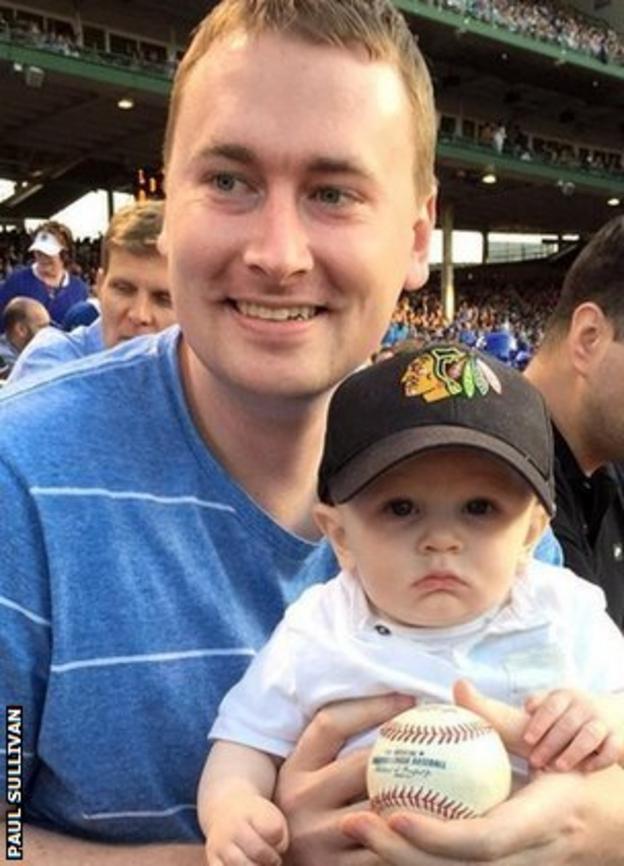 A father with his son after catching a ball at a Major League Baseball game
