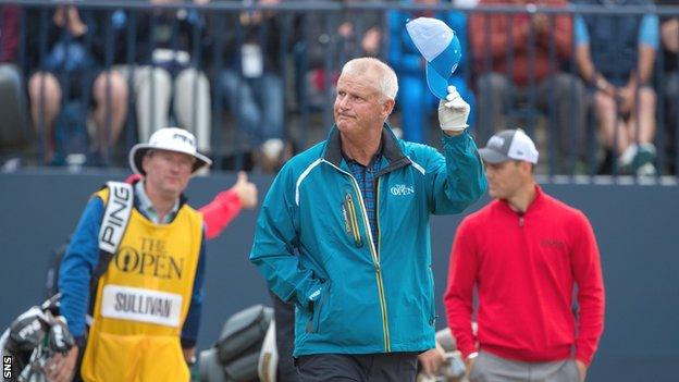 Sandy Lyle acknowledges fans after hitting the opening tee shot of this year's Open