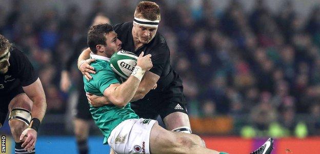 New Zealand's Sam Cane tackles Ireland's Robbie Henshaw