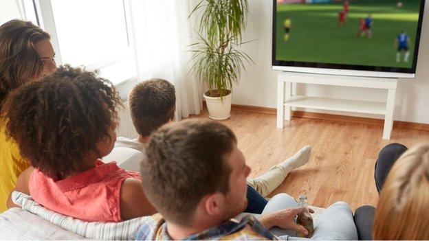 Group watching sport on TV