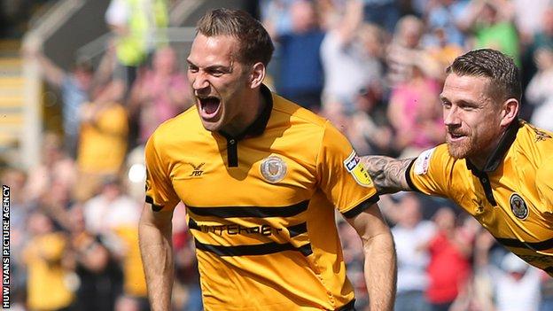 Mickey Demetriou (left) celebrates scoring the opening goal against Bury