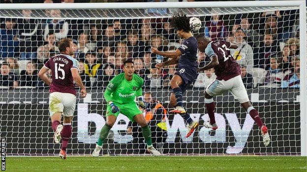 Nathan Ake goes close to scoring for Manchester City with a header against West Ham in the Carabao Cup