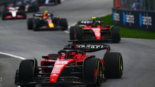 Ferrari's Charles Leclerc leads a train of cars including team-mate Carlos Sainz and Sergio Perez
