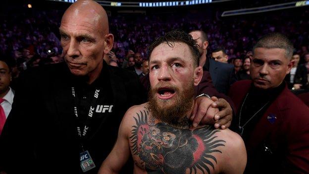 McGregor was escorted back to his changing room while Nurmagomedov was still being calmed in the octagon