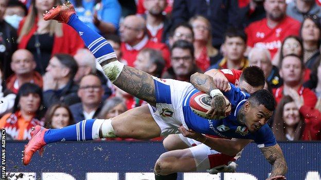 Montanna Ioane of Italy is tackled by Josh Adams