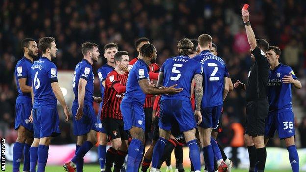 Leandro Bacuna is shown red card as the players clash