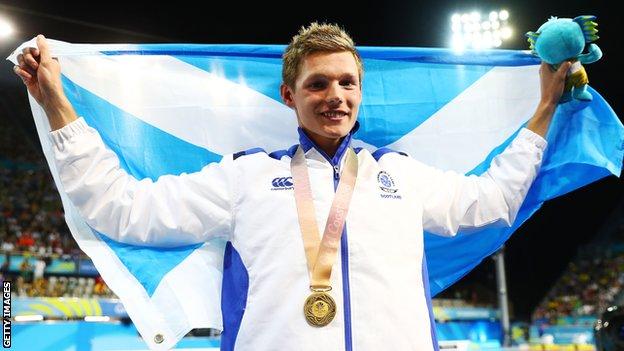 Duncan Scott celebrates his 100m freestyle gold at the Commonwealth Games