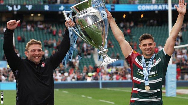 Ben Youngs (right) holds the Premiership trophy aloft with his brother Tom