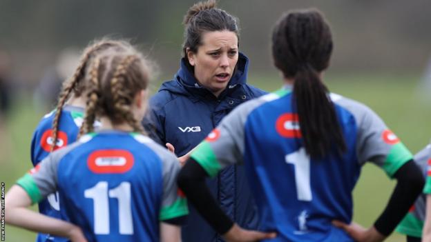 Sioned Harries coaching young girls