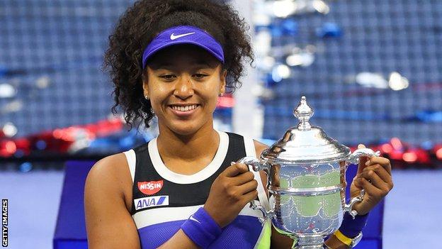 Naomi Osaka lifts the US Open trophy after winning the 2020 tournament