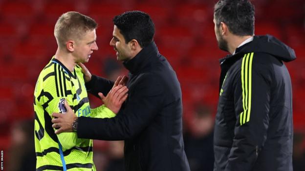 Oleksandr Zinchenko is spoken to by Mikel Arteta after the win at Nottingham Forest