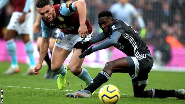 Leicester's Wilfred Ndidi battles for the ball with Aston Villa's John McGinn