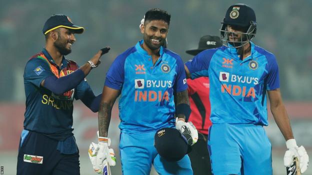 Indian striker Suryakumar Yadav (centre) is congratulated as he walks off the pitch after hitting 112 pitches in the third T20 against Sri Lanka