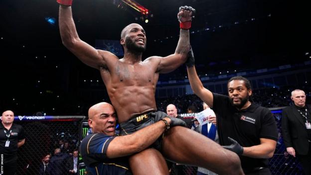 Leon Edwards celebrates beating Kamaru Usman to retain his welterweight title