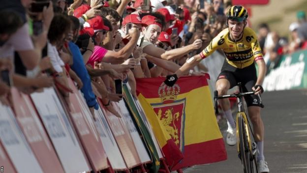 Sepp Kuss high-fives fans as he wins stage six of the 2023 Vuelta a Espana