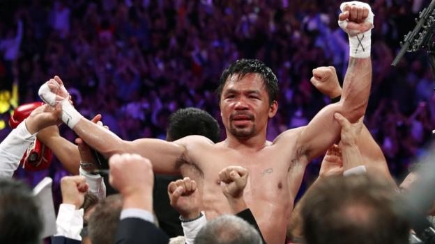 Pacquiao wins world title at 40