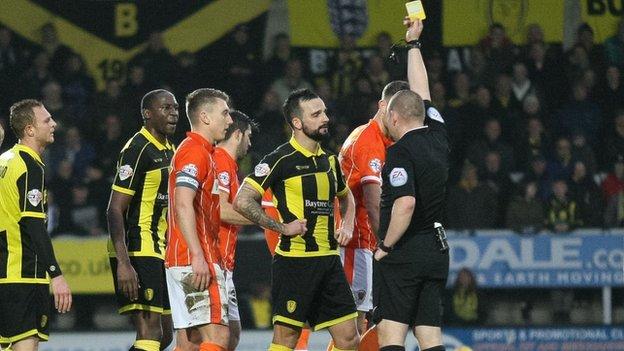 Robbie Weir is shown a second yellow card