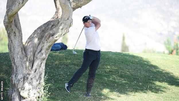 Callum Shinkwin takes his second shot on the 18th