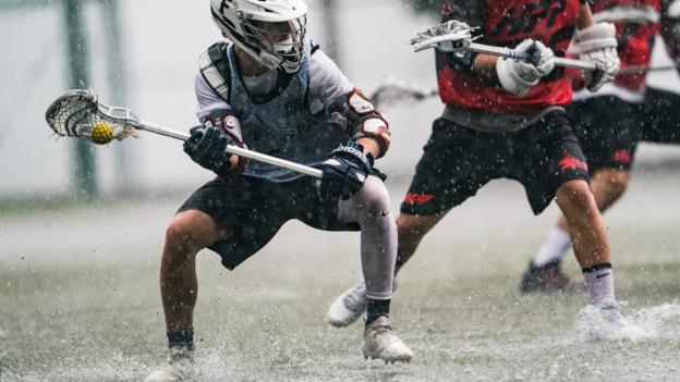 HONG KONG, HONG KONG - APRIL 19: West Mo (L) of Fogo in action during Silver Division match against Hong Kong High Performance (HPP) on day one of the Hong Kong Lacrosse Open at Stanley Ho Sports Centre on April 19, 2019 in Hong Kong, Hong Kong. (Photo by Lampson Yip - Clicks Images/Getty Images)