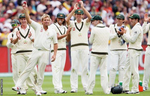 Shane Warne of Australia celebrates his 700th wicket with his team-mates after bowling out Andrew Strauss of England in 2006