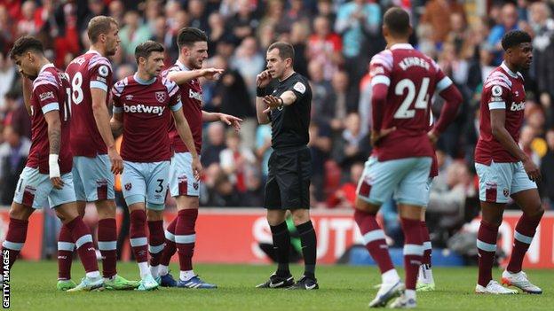 West Ham players surround referee Peter Bankes during Sunday's Premier League match at Southampton