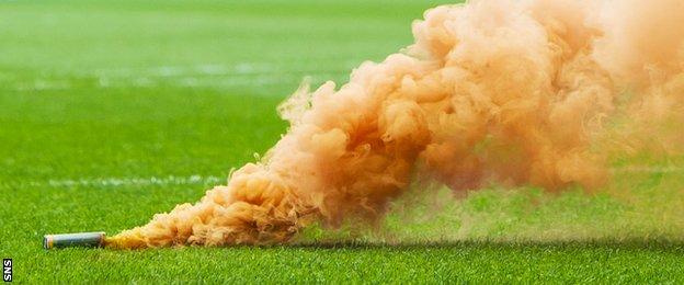 A flare thrown at a Scottish football match