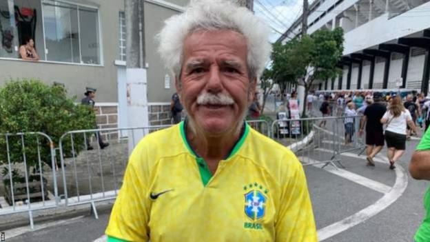 Pele fan Deofilo de Freitas wearing a Brazilian shirt