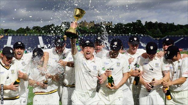 Durham celebrate with the County Championship trophy