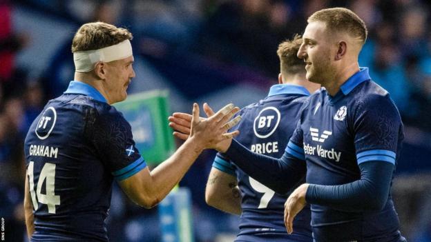 Darcy Graham and Finn Russell (right) were the star men for Scotland as ill-disciplined Argentina were beaten 52-29 at Murrayfield