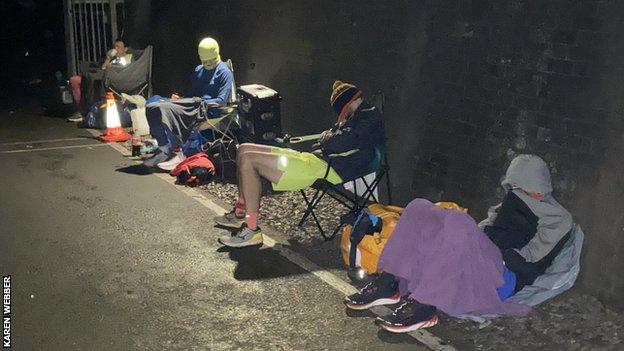 Runners asleep outside the tunnel
