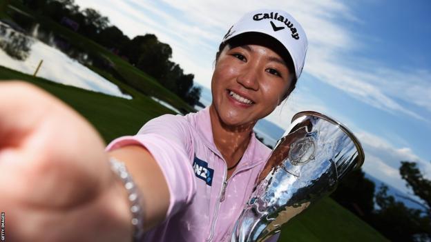 New Zealand's Lydia Ko holding the Evian Championship trophy in 2015