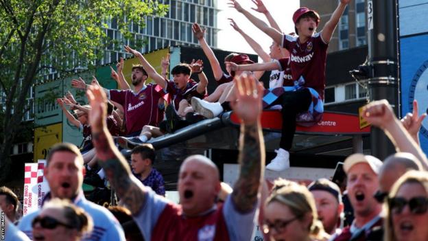 West Ham fans gather to watch the Hammers' trophy parade