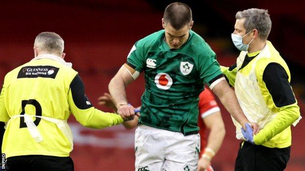 Johnny Sexton is helped off the field in Cardiff last Sunday