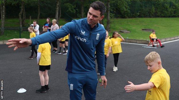 James Anderson coaches pupils at his former primary school