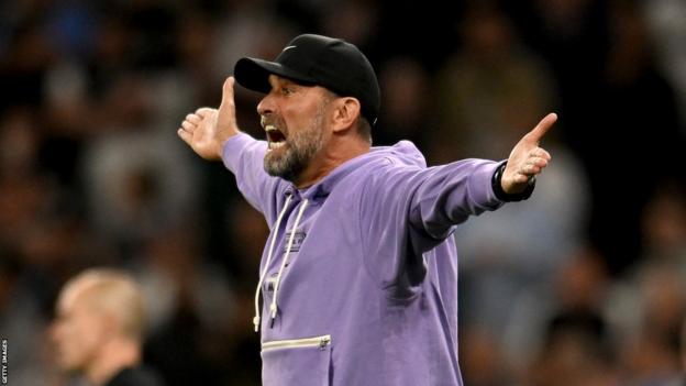 Jurgen Klopp with his arms raised in shock during Liverpool's defeat away at Tottenham