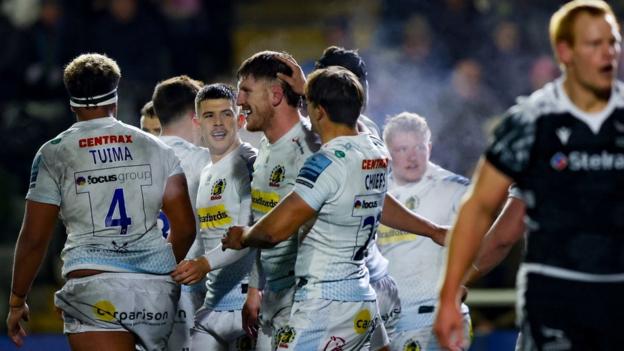 Exeter celebrate their third, match-winning try at Newcastle