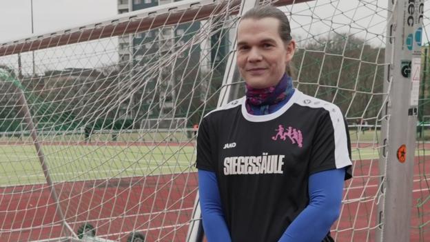 Charlotte Jerke stands in front of a goal net in Berlin