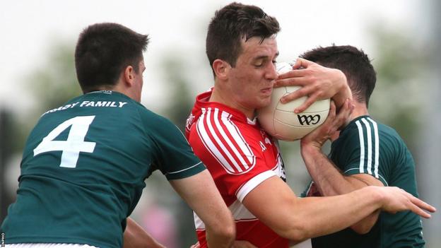 Shane McGuigan attempts to get past Kildare's Mick O'Grady and Eoin Doyle in the 2018 All-Ireland qualifier
