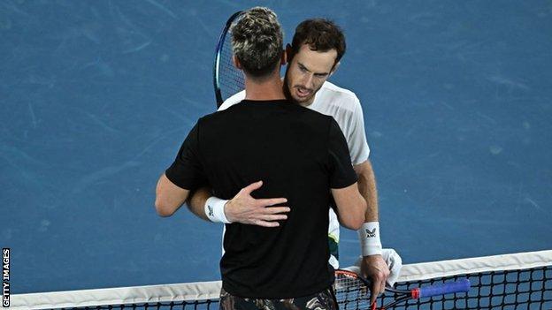 Andy Murray and Thanasi Kokkinakis hug at the net