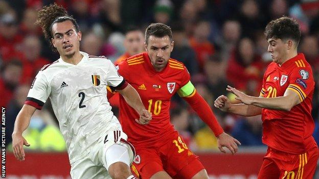 Belgium's Arthur Theate (left) is challenged by Aaron Ramsey (centre) and Daniel James of Wales