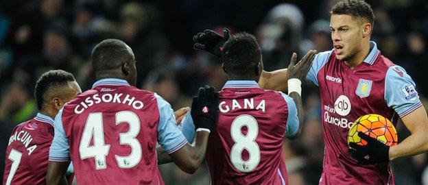 Rudy Gestede is congratulated after scoring Aston Villa's equaliser against Leicester City