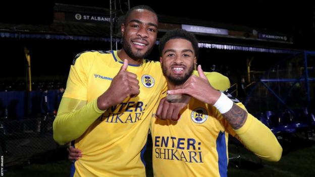 St Albans City players Bayley Brown and Liam Sole celebrate their shock FA Cup first-round win over Forest Green Rovers in 2022