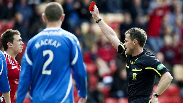 Steve Conroy shows the red card