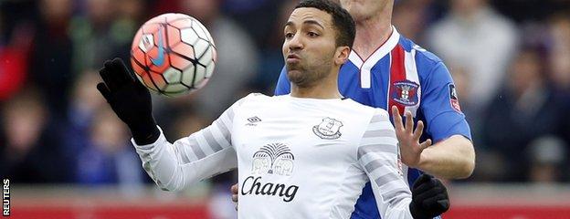 Aaron Lennon chests the ball