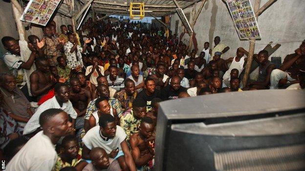 Fans in Africa crowded around a television