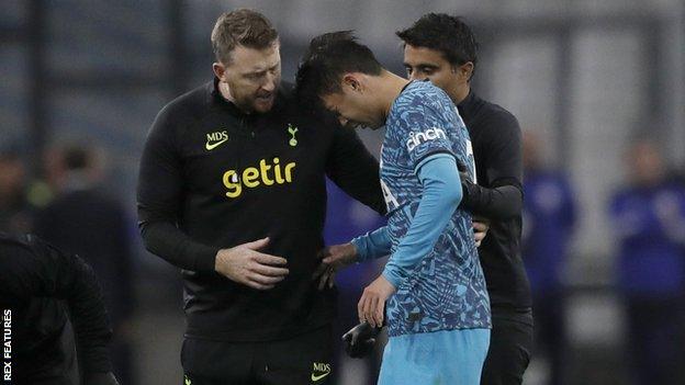 Son Heung-min receives treatment during Tottenham's Champions League game with Marseille