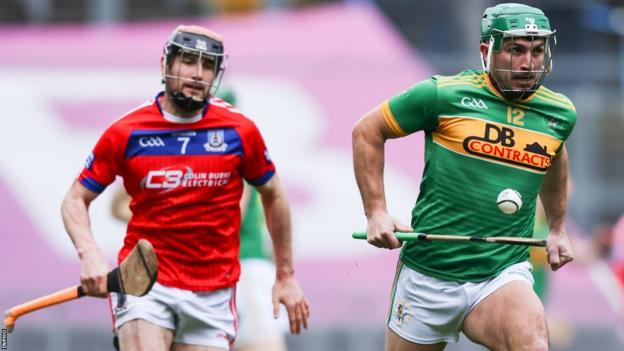 Dunloy's Nigel Elliott speeds away from Cathal Burke at Croke Park