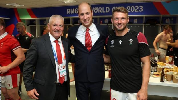 Warren Gatland and Dan Biggar with the Prince of Wales in the changing room after victory over Fiji in Bordeaux