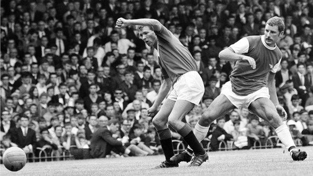 Two managerial giants of the future - Glasgow Rangers striker Alex Ferguson and Arsenal's Terry Neill battle for the ball in a 1967 friendly